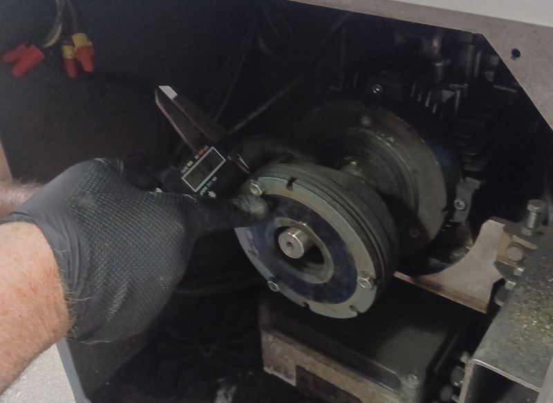 Adjusting band saw brake gap to .133in